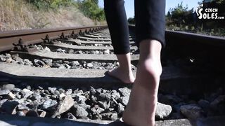 Barefoot walking and dirty feet on rails (long toes, foot teasing, sexy feet, petite, public feet)